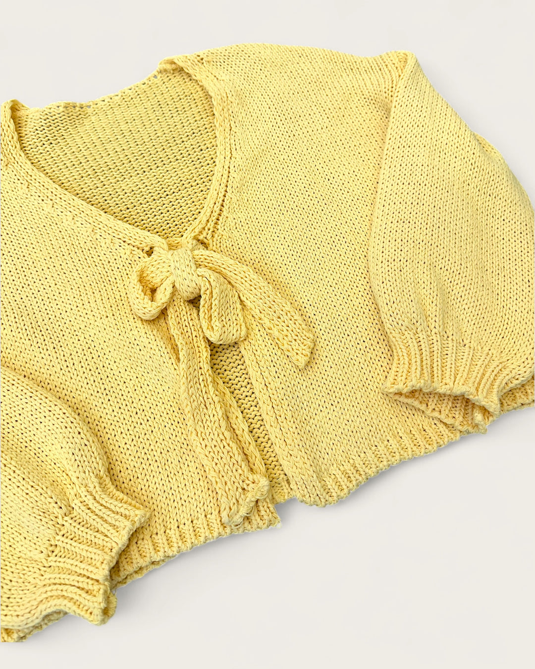 STRICKJACKE SCHLEIFE MARIGOLD